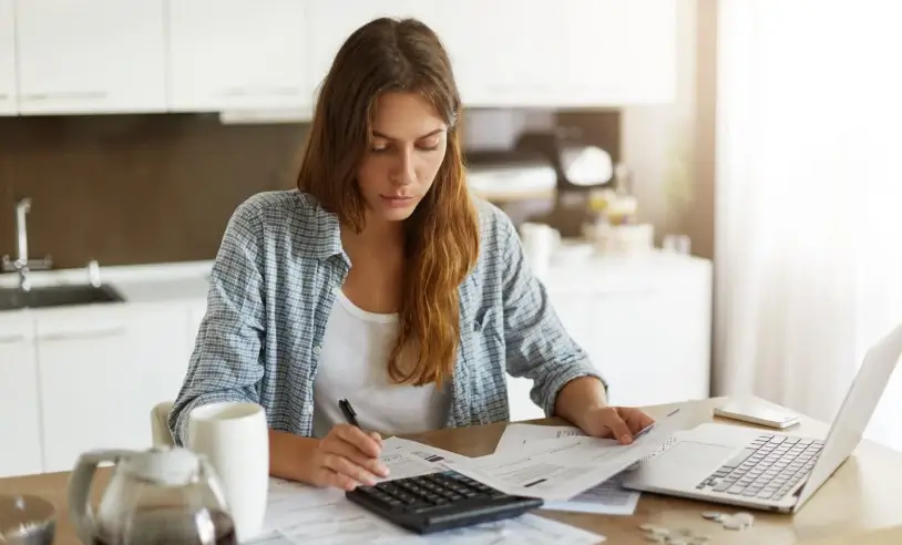 young-woman-checking-her-budget-doing-taxes-scaled_p28463_cover_image_resized